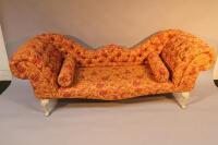 A 20thC button back upholstered chaise longue.