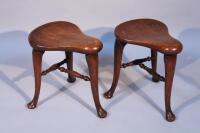 A pair of 19thC saddle stools