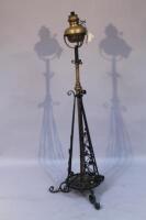 A 19thC wrought iron and brass oil lamp stand