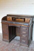 An early 20thC twin pedestal roll top desk (AF) 103cm wide