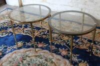 A pair of brass circular occasional tables