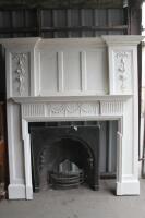 *19thC cast metal fireplace with pine painted surround.