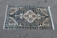 A blue ground Persian style rug