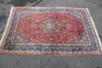 A large red ground Persian style carpet (AF) 211cm x 320cm.