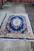 A large blue ground floral design carpet