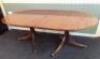 A mahogany three pillar dining table