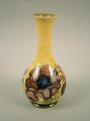 A Moorcroft poppies pattern bottle shaped vase