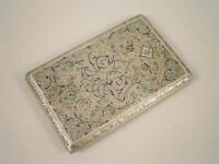 A Middle Eastern white metal and enamel cigarette case