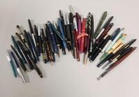 A large quantity of fountain pens and biros