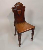 A Victorian oak hall chair