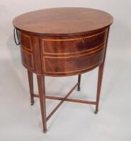 A George III mahogany and tulipwood cross banded oval work table