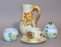 A Clarice Cliff Queen Elizabeth II Coronation cup and saucer