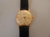 A gentlemans Longines 9ct gold cased wrist watch