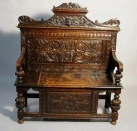 An 18th century style oak monks bench