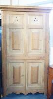 A tall pine corner cupboard