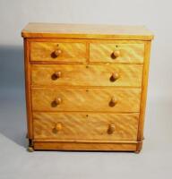 A Victorian satinwood chest of drawers