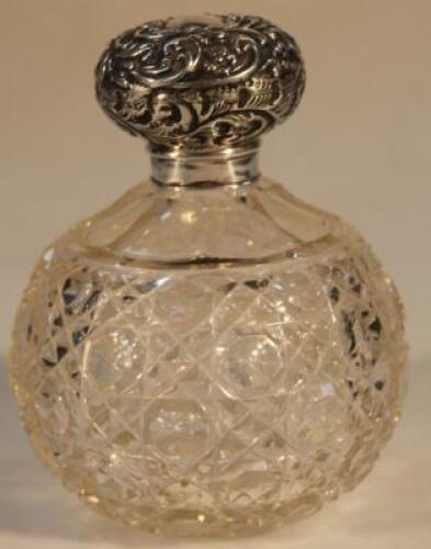 An Edwardian silver capped glass scent bottle