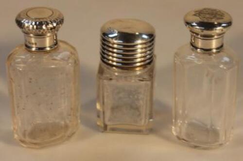 Three Edwardian silver capped scent bottles