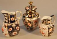 A Royal Crown Derby Imari baluster vase and cover and two jugs