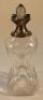 An early 20thC waisted glass decanter with silver collar