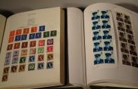 Two stamp albums containing British stamps