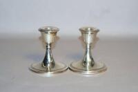 A pair of George V dwarf silver candlesticks