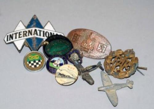 A selection of automobilia and transport related pin badges