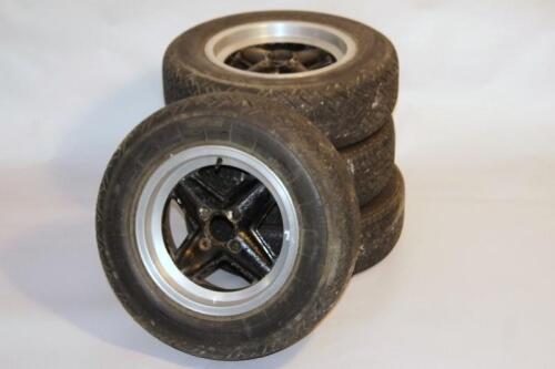 A set of four Revolution Brabham style four spoke alloy wheels