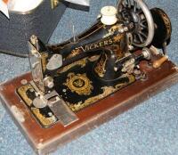 A cased manual sewing machine.