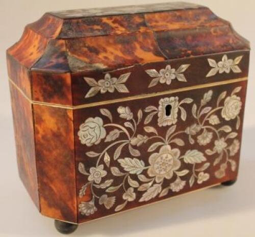 An early 19thC tortoiseshell and mother of pearl inlaid tea caddy