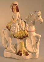 A 19thC Staffordshire pottery equestrian figure group of a woman titled 'Home'