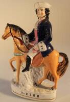 A 19thC century Staffordshire pottery equestrian figure group of Tom King