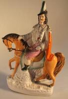 A 19thC Staffordshire pottery figure group of a horseman