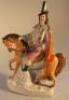 A 19thC Staffordshire pottery figure group of a horseman