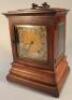 A 19thC oak cased mantel clock by Armstrong and Brothers