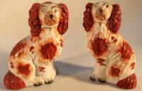 A pair of 19thC Staffordshire pottery spaniels