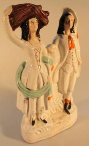 A 19thC Staffordshire flatback figure of two farm workers