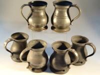 Six 19thC large pewter tankards.