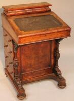 A Victorian burr walnut veneered Davenport with compartmentalised internal top section