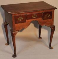 A Georgian period oak lowboy