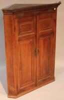 A late 19thC\early 19thC oak corner cupboard