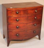 A 19thC pine and mahogany bow front chest