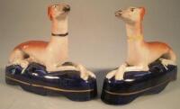 A pair of 19thC Staffordshire quill holders