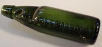 A Stamford green codd bottle