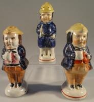 Three 19thC Staffordshire novelty pepper pots