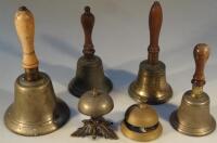 Four brass hand bells and two shop counter bells.