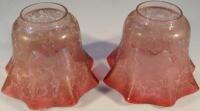 A pair of 19thC etched glass cranberry lamp shapes.