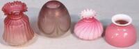 Four cranberry and satin glass oil lamp shades.