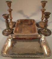 Two pairs of silver plated candlesticks