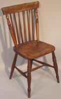 A 19thC elm comb back kitchen chair.